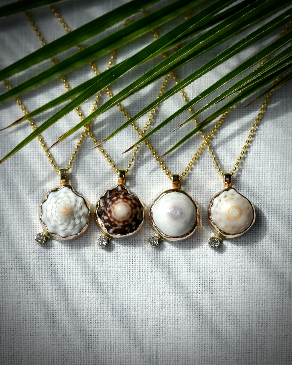 Four Petite Puka Dot necklaces with natural Hawaiian puka shells and sparkling topaz accents on 14K gold-filled chains
