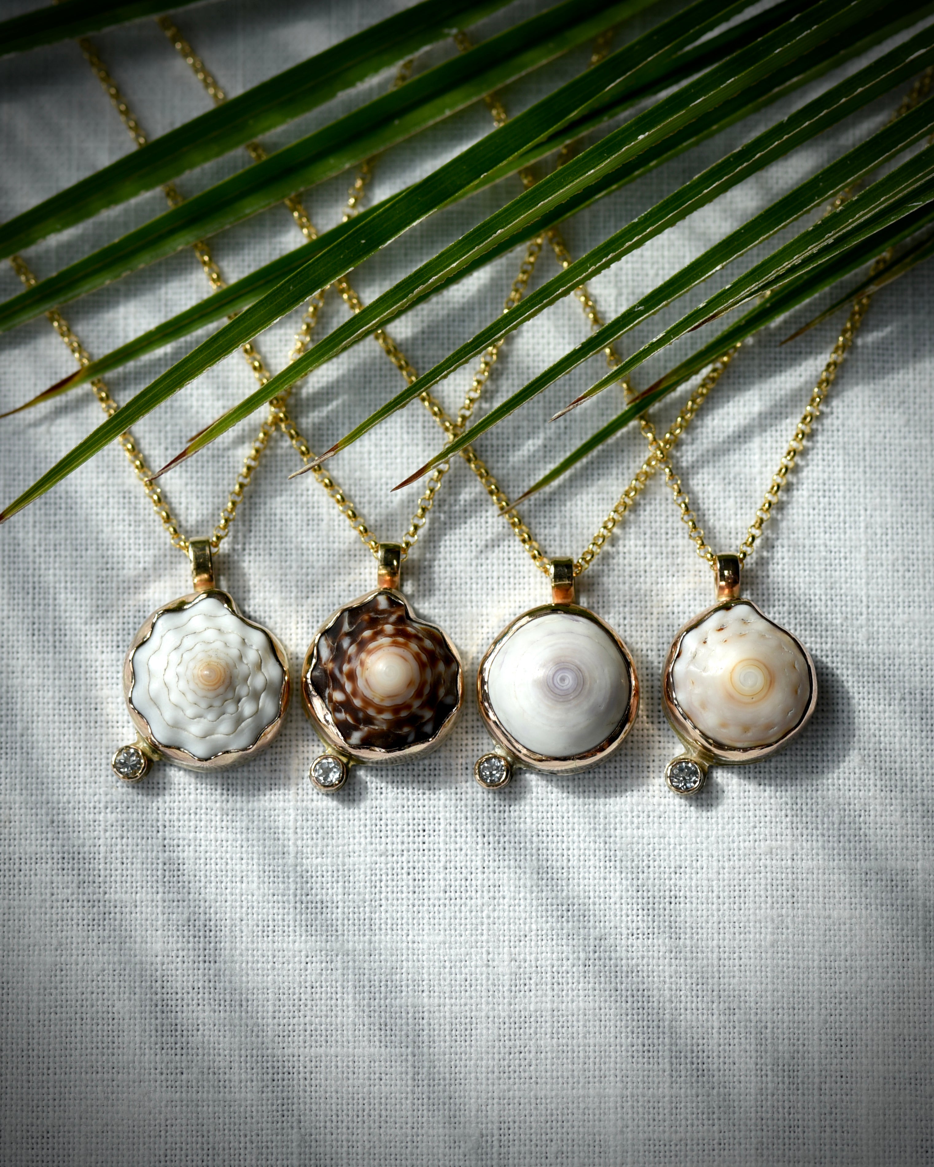 Four Petite Puka Dot necklaces with natural Hawaiian puka shells and sparkling topaz accents on 14K gold-filled chains
