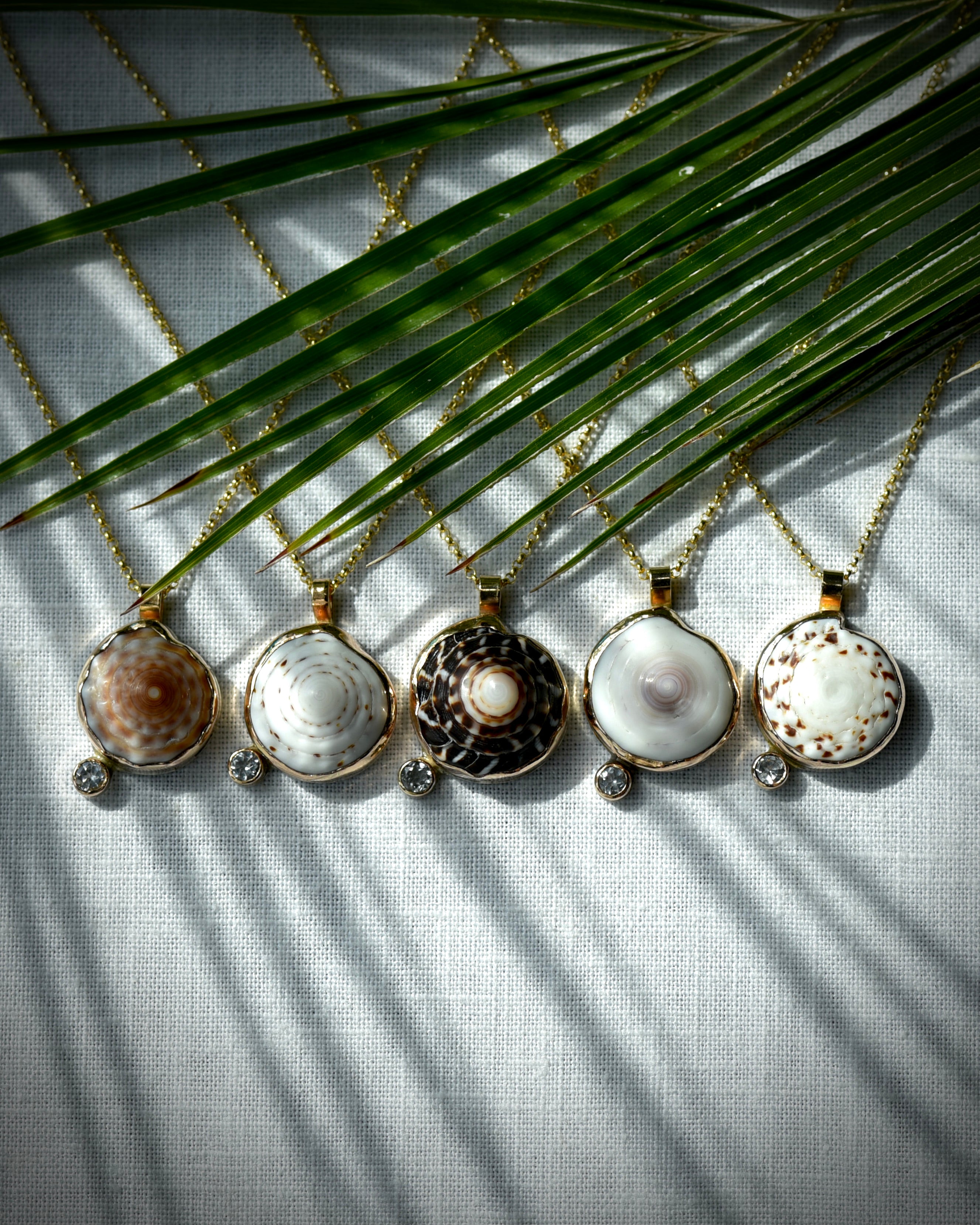 Five Midi Puka Dot necklaces with natural Hawaiian puka shells and sparkling topaz accents on 14K gold-filled chains