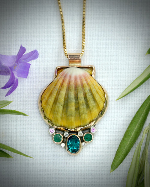 Hawaiian sunrise shell necklace with blue-green topaz, Zambian emeralds, and tiny pink tourmalines in 14K gold fill